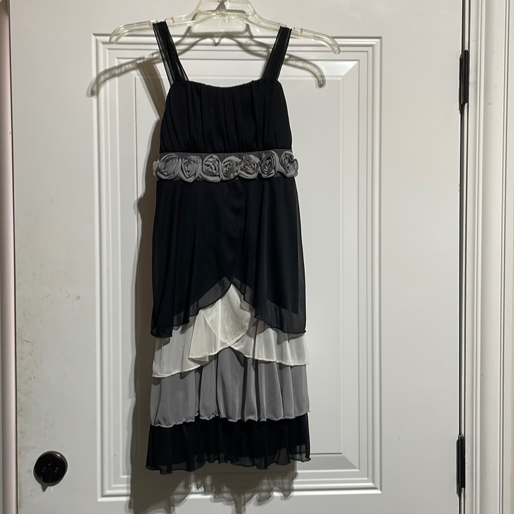 Black dress with ruffles and flowers